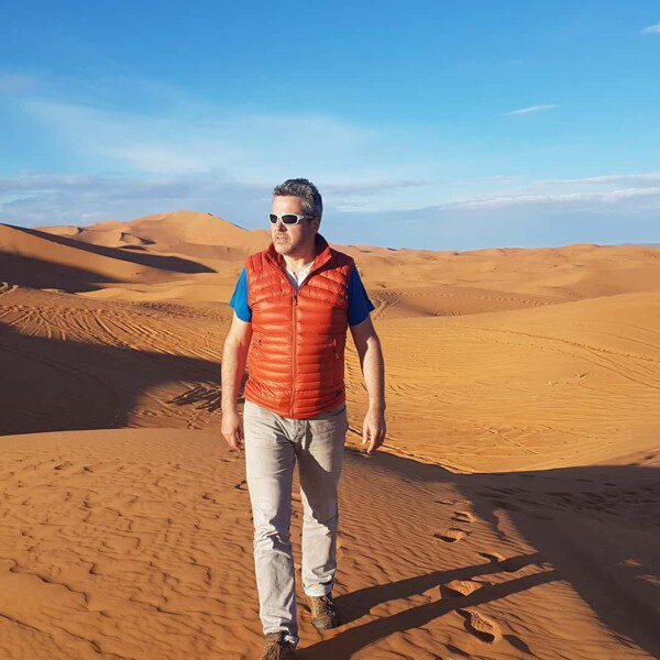 Man exploring the Sahara Desert on a Morocco Group Tour