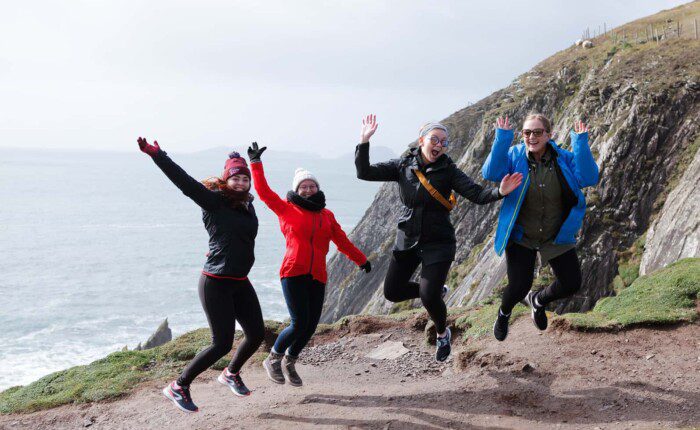 Happy clients jumping with joy at Slea Head, Co. Kerry