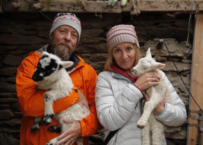 Couple holding baby lambs in Dingle, Co. Kerry