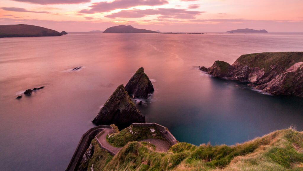 Dunquin Pier bathed in the soft twilight light with serene waters. Kerry photography adventure