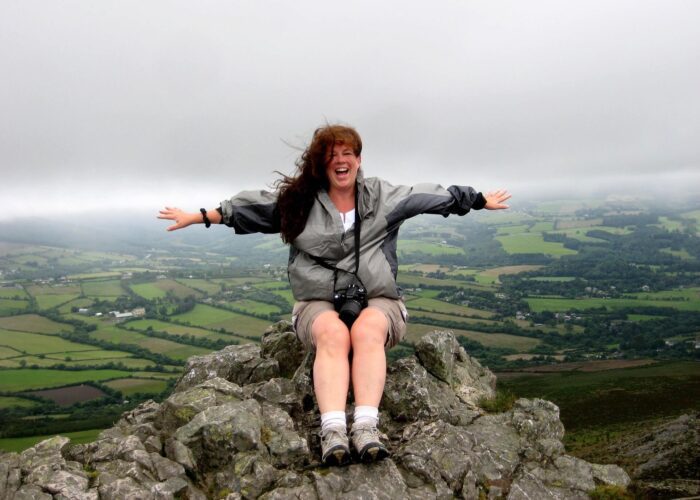 Woman on top of Great Sugar Loaf Ireland