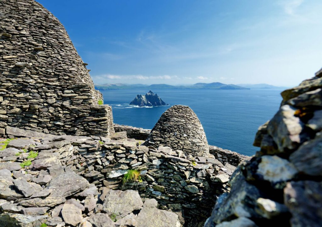 Exploring Skellig Michael. View from Great Skellig to Little Skellig and irish coastline in the background