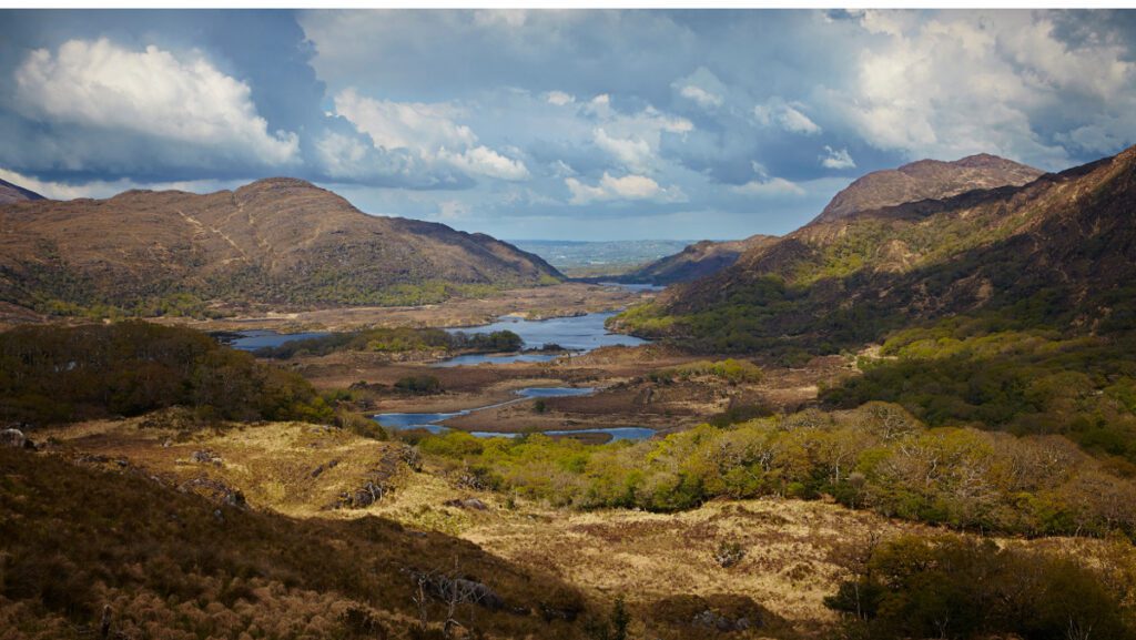 Panoramic view from Ladies View overlooking Killarney National Park during sunrise.